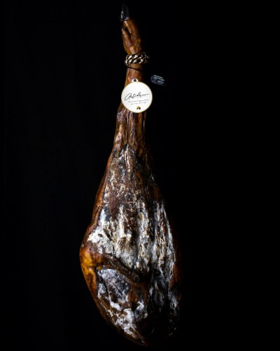 1/2 100% Iberian acorn-fed ham with a knife